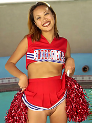 Asian cheer girl practices by the pool