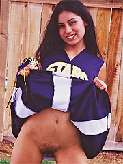 Latina teen cheerleader flashing and spreading